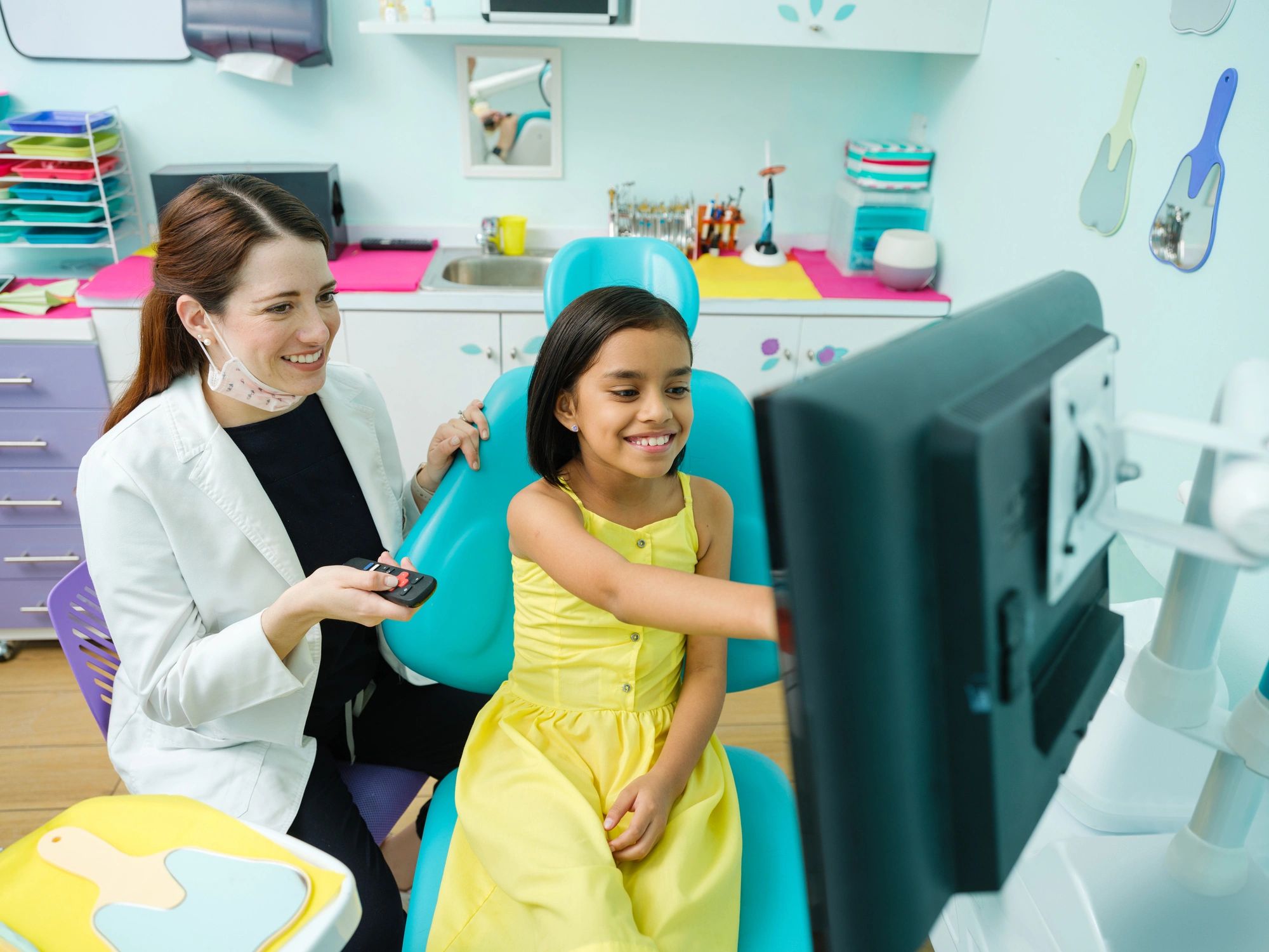 Patient and dentist reviewing dental images during a consultation