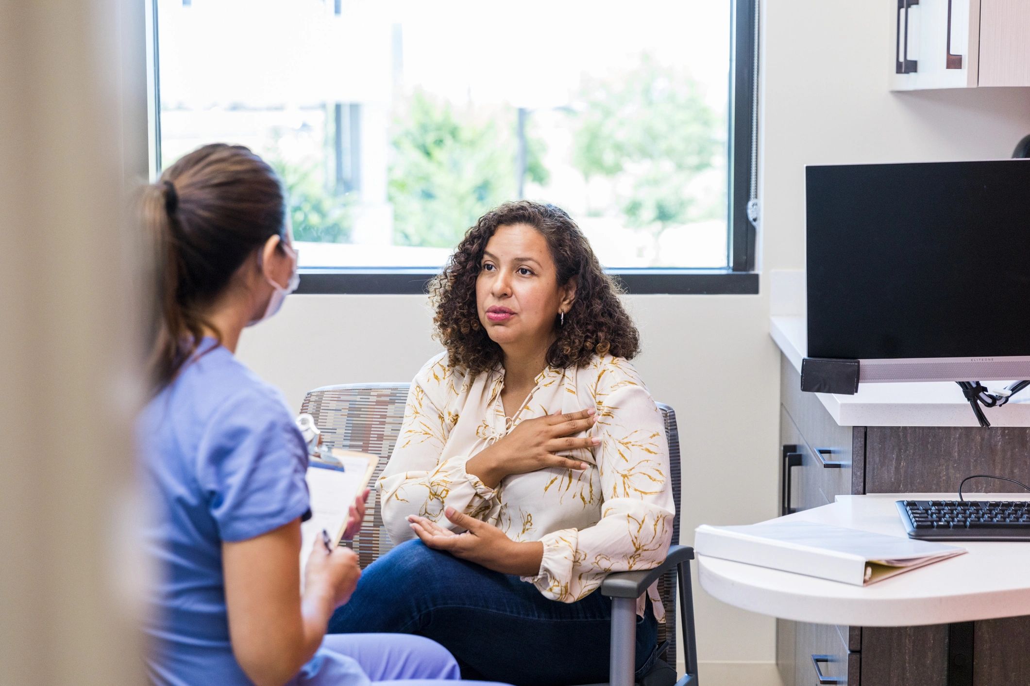 Dentures Patient speaking with a care team member during a consultation