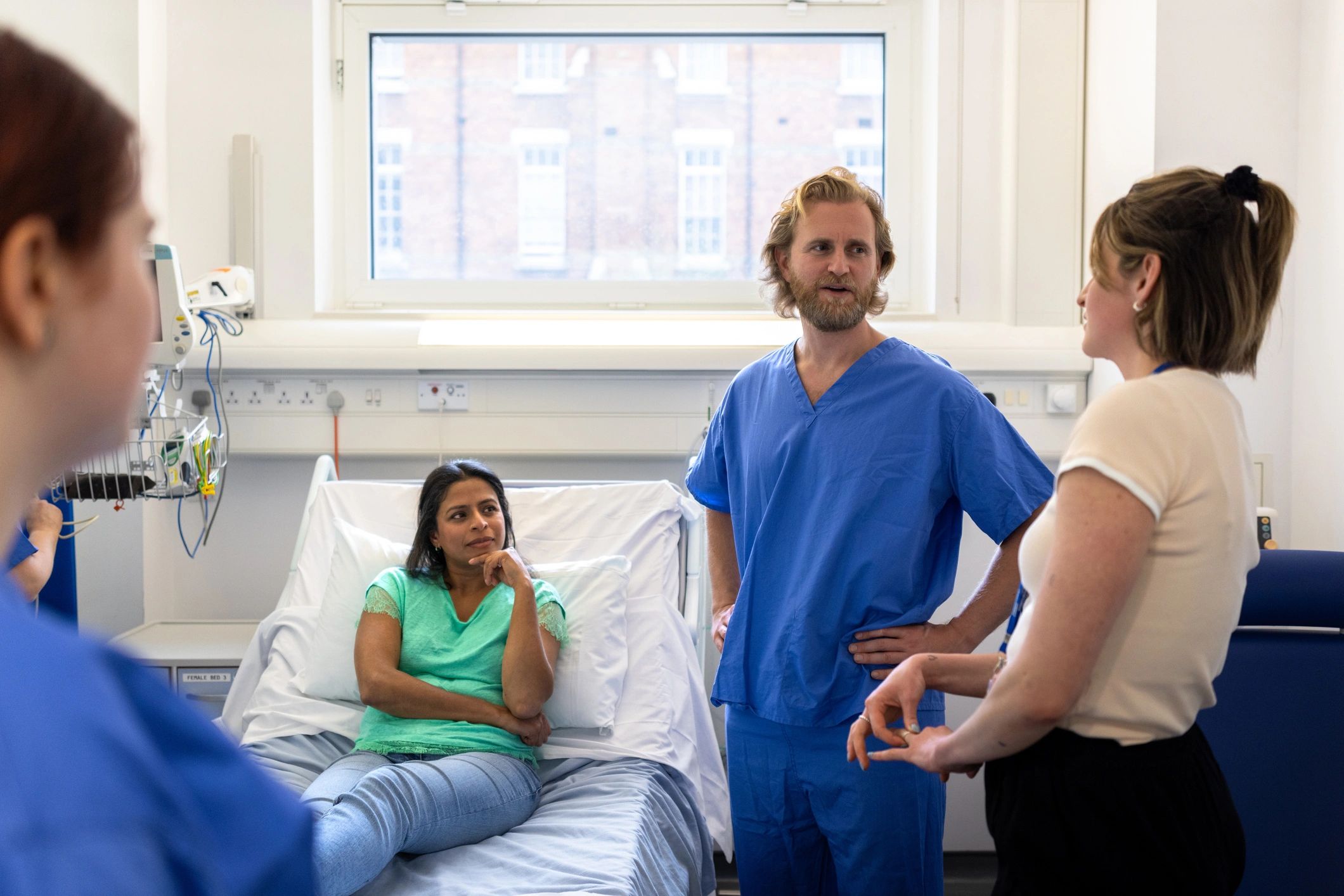 Dental professionals discussing treatment information with a patient