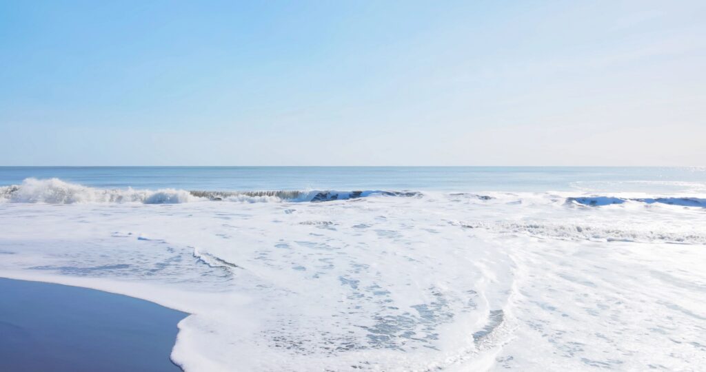 waves beach sky