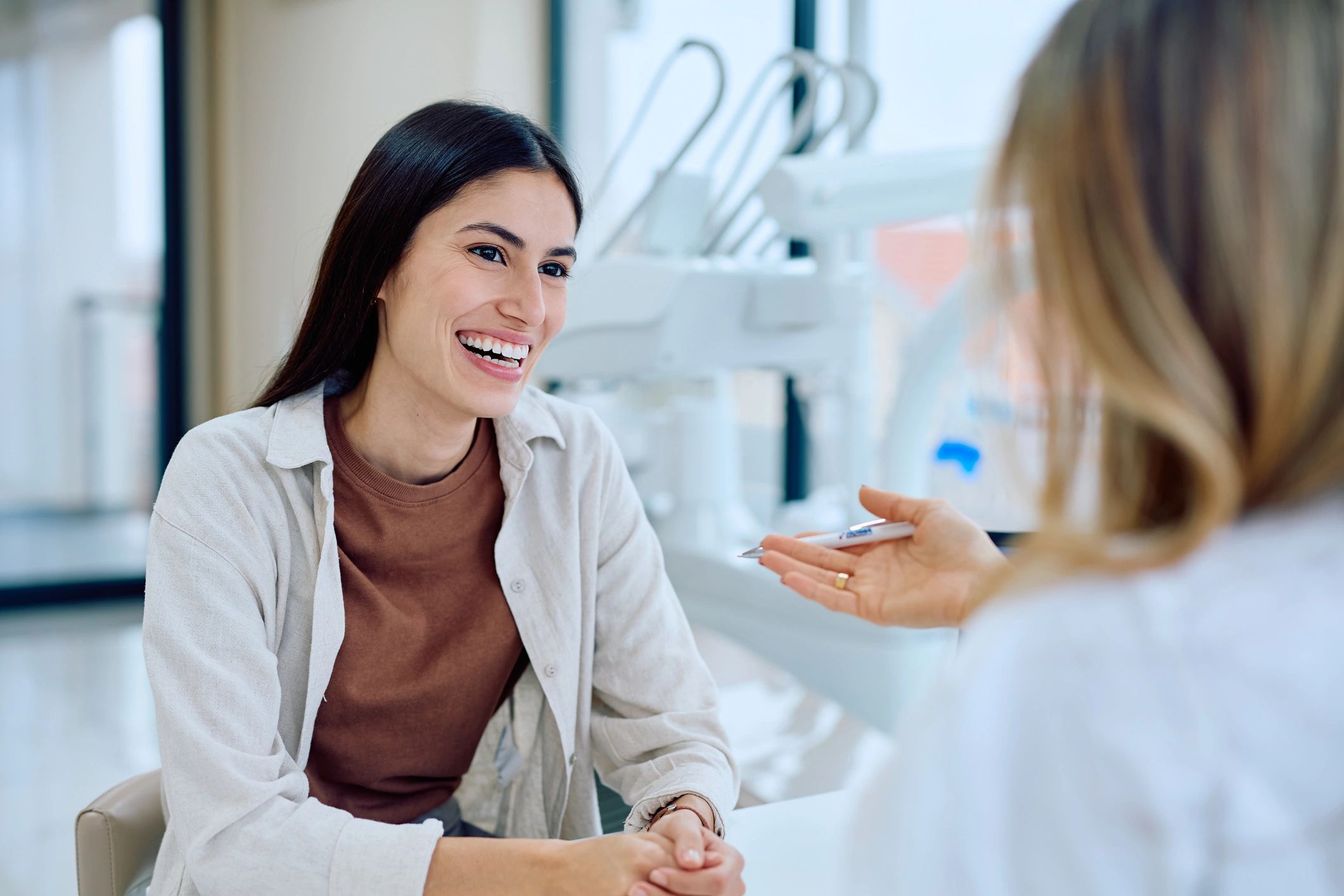 Dentist consulting with a patient in a modern dental office