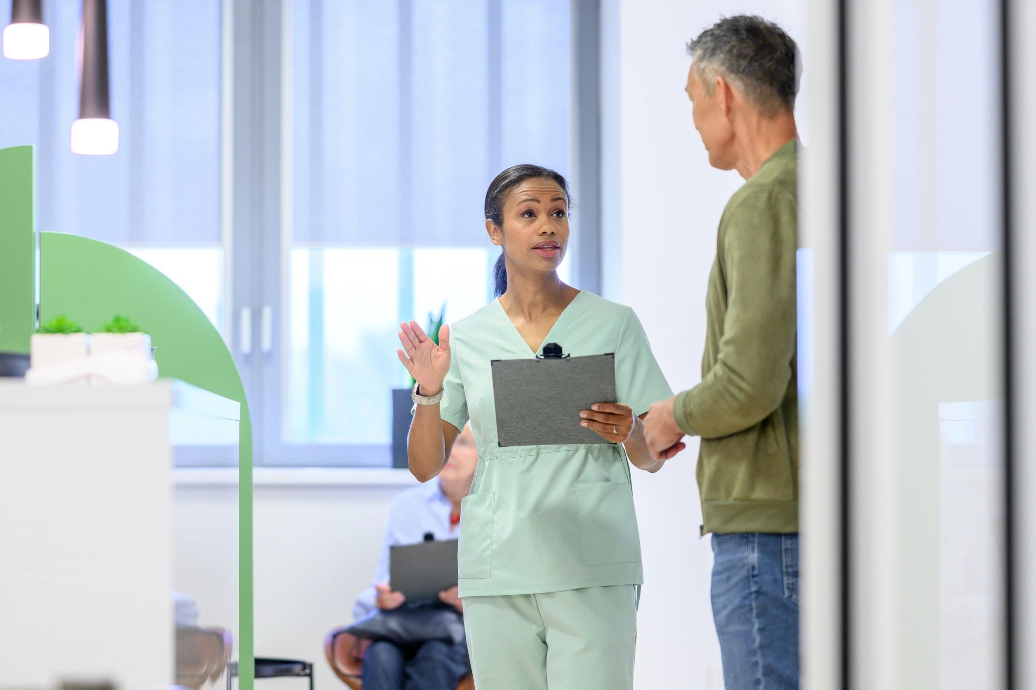 Healthcare professional consulting with a patient in a clinic
