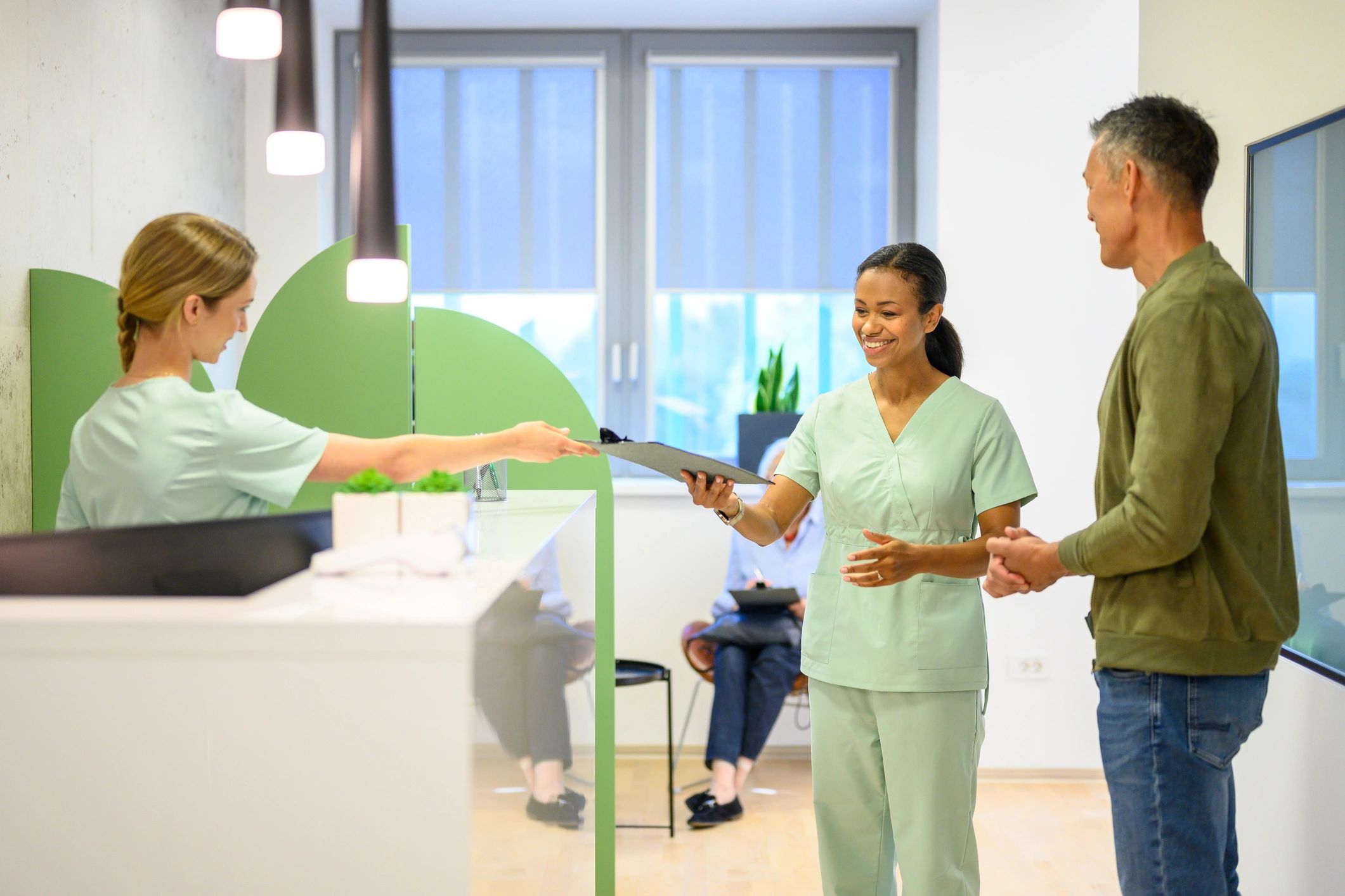 Patient checking in at a welcoming dental office reception