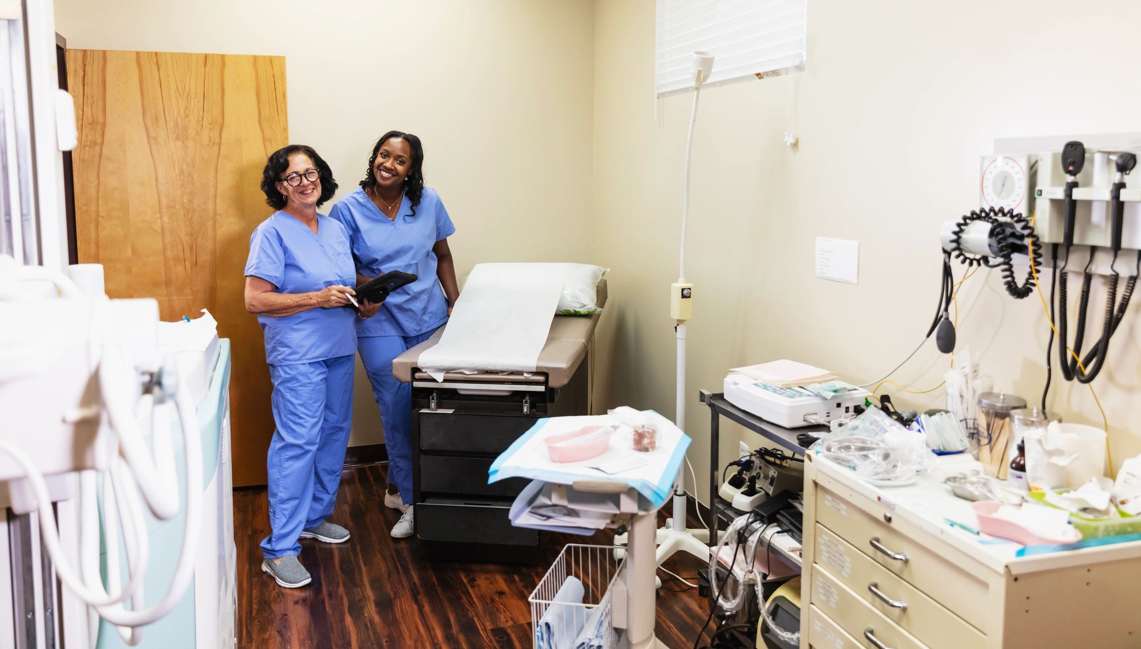 Friendly dental professionals in an examination room