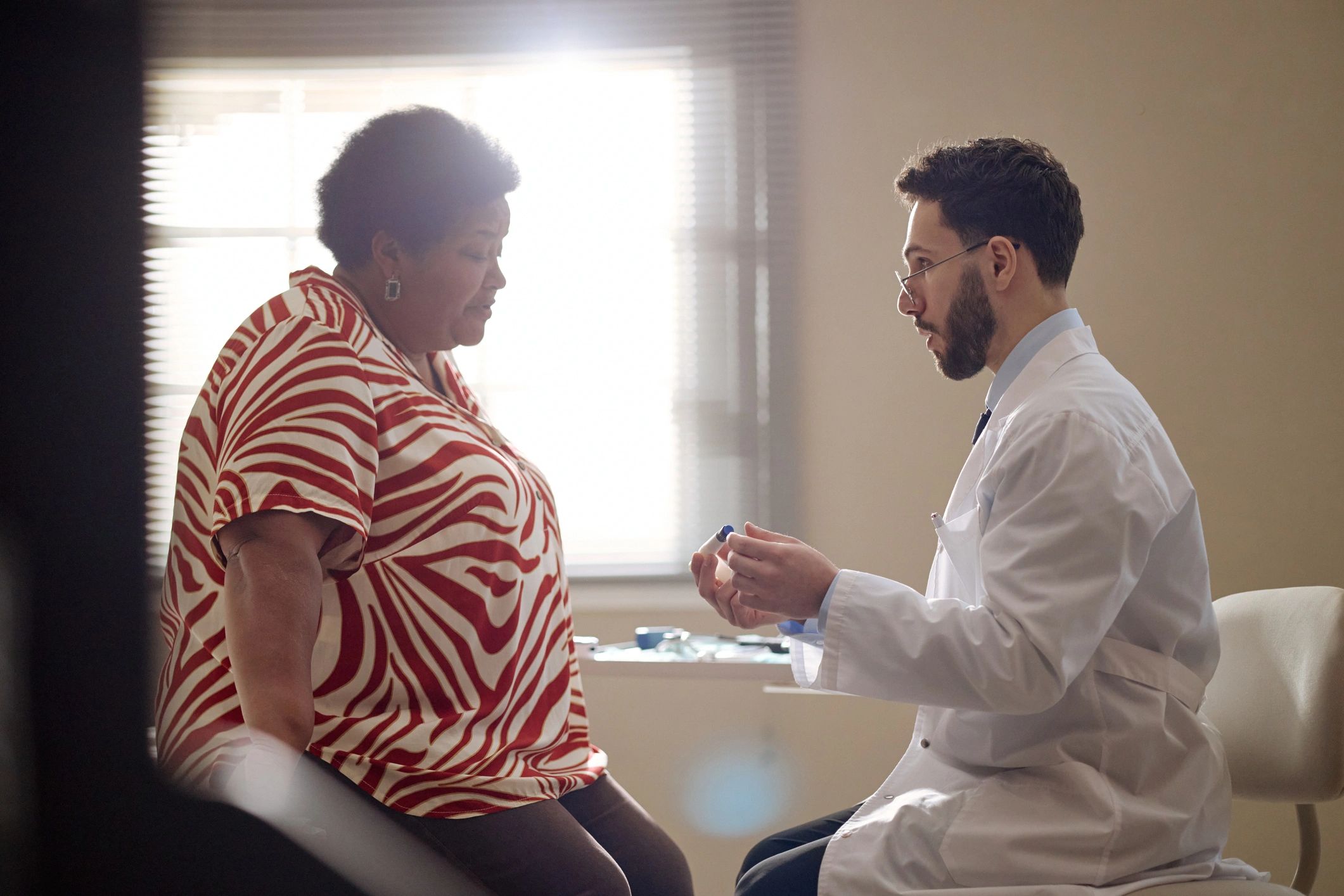 Patient discussing treatment questions with a doctor