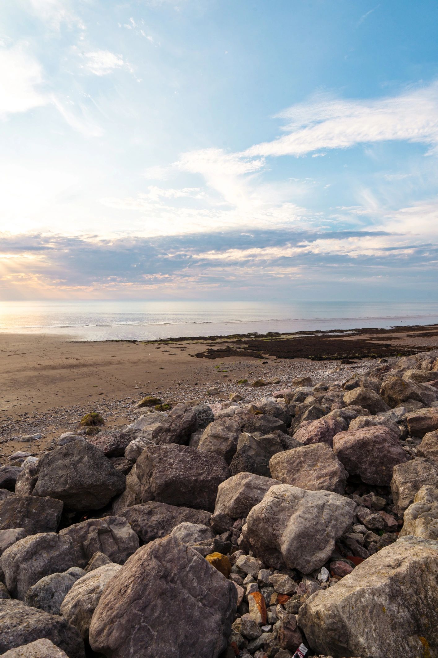 Home Polished beach sunset scene with warm light and calm coastal water