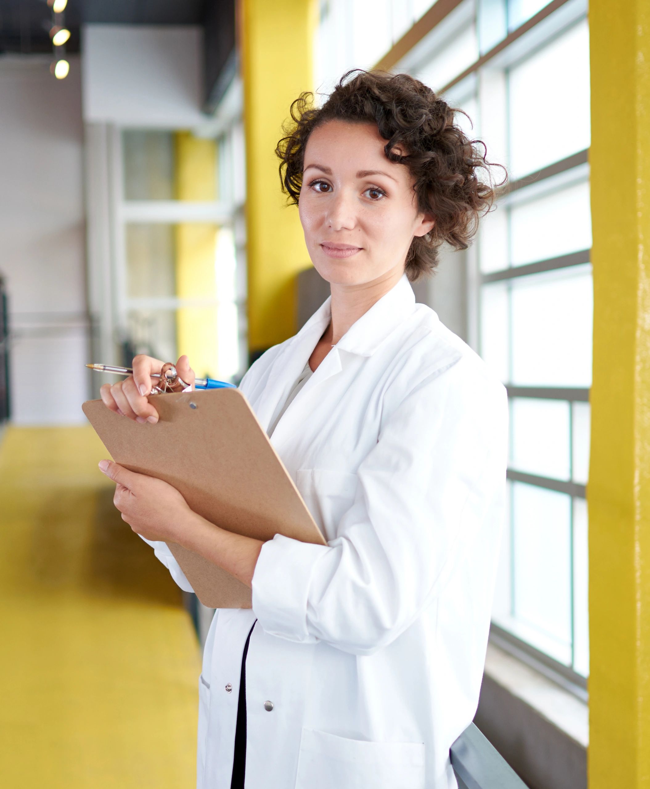 Dental professional reviewing patient information in clinic